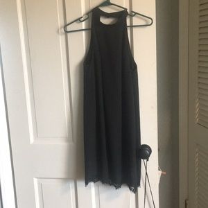 Black tent dress, open back.